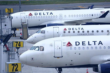 Focus: Delta bets on premium travel as 'shock absorber' for economic  downturn | Reuters